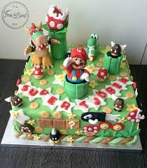 Mario is popping out of the cake hitting one of the blocks, holding a toadstool with many other of his friends, enemies and obstacles from his wildly. Super Mario Tutorial Frau Fon Dant
