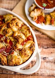 To make the dough, place the flour, oregano, sugar, salt and yeast in a large bowl or the bowl of a stand mixer, making sure to keep the salt and yeast on separate sides until you begin. Pull Apart Pizza Bread Recipe Easy Side Dish Recipes