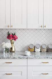Small tiles (or broken pieces of glass or ceramic material in uneven sizes) can be used to create a mosaic work of art that's as simple or as detailed. White Glazed Porcelain Arabesque Backsplash Tile Backsplash Com