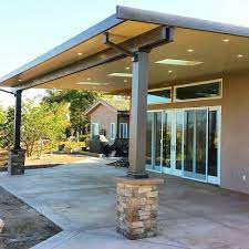 Insulated Aluminum Patio Cover With Skylights Led Recessed Lighting And Stone Wrapped Colum Covered Patio Design Aluminum Patio Covers Backyard Covered Patios