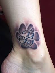 Nevíte si rady s výběrem vhodné péče o tlapky psů? 10 Beautiful Dog Tattoos Every Dog Lover Will Appreciate Flawssy Pawprint Tattoo Print Tattoos Foot Tattoos