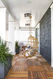 Whether you're screening windows, screening your porch or screening your patio. Covered Porch With Hanging Rattan Chairs Transitional Porch