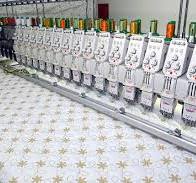 Roupas de bebê e máquinas de bordados - | Pulsar Imagens ...