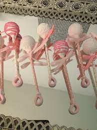 Cupcakes cake pops and biscuits. Pink And White Drizzled And Sprinkled Baby Rattle Cake Pops Pop Star 50 Adorable Cake Pops That Make The Perfect Sweet Baby Shower Treat Popsugar Family Photo 42