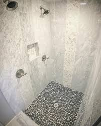Rounded pebble stones can be great. Marble Shower With Black Floor Novocom Top