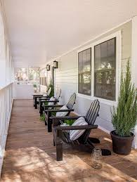 Black Adirondack Chairs On A Covered Porch Deck Adirondackchairs Porch Furniture Modern Outdoor Furniture Porch Chairs