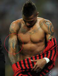 One of them, on his right upper arm, depicts a skull and four aces, with the words the world is yours in english. Kevin Prince Boateng S 30 Tattoos Their Meanings Body Art Guru