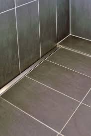 Browse 106 photos of shower floor tile. In Praise Of Flatness Stylepark Shower Drain Shower Door Designs Bathroom Lighting Design