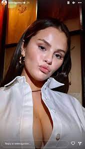 Selena Gomez nearly suffers major wardrobe malfunction as her shirt pops  open to reveal black lingerie in new photos 