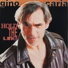 Download GINO CARIA album songs: Hold the Line