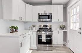 The door in the image is open 90 degrees and the 50mm gap is enough clearance. What Should I Do With This Awkward Gap In My Kitchen Cabinets