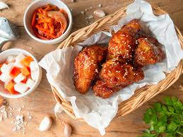 Allow any excess to drip off over the bowl, then slowly lower into the hot oil, letting go when the chicken piece is. Kfc A Guide To Eating Korean Fried Chicken In Seoul Lonely Planet