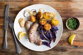 Sausages With Potatoes And Red Cabbage Recipe Nyt Cooking Full Meal Recipes Red Cabbage Recipes Rotisserie Chicken Salad
