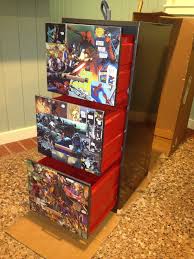 This cabinet features one drawer and one cabinet for plenty of storage of books movies knickknacks and so much more. 9 Comic Storage Ideas Comic Storage Comic Book Storage Comic Book Rooms