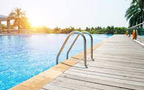 An artificial area of water for swimming, or a building containing this: Best Swimming Pools In Sharjah Pullman Venue3 Club More Mybayut