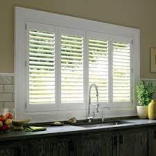 Not only do you need the some may not think that an aluminum blind would fit well in a kitchen, but we are here to prove that all window treatments can look wonderful in your kitchen. How To Dress Kitchen Windows