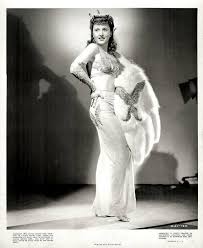 Here's BARBARA STANWYCK in a still from the 1943 William Wellman film, "Lady  of Burlesque." Stanwyck began in show biz as a dancer. Although she never  danced in an actual burlesque show,