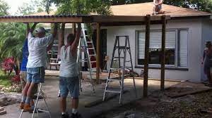 Then unbolt the posts and cut them all to the desired roof height. Lifting Kris S Carport Youtube