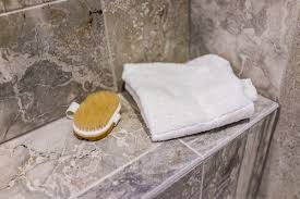 Photo about close up attractive young bare sad worried young man taking shower, sitting on the floor with eyes closed. Sit And Relax How Shower Benches Add To Your Enjoyment