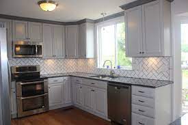 Traditional kitchen brown cabinet black countertop. Gray Cabinets And Blue Pearl Granite Black Kitchen Countertops Grey Countertops Grey Cabinets