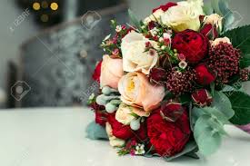 See more ideas about beautiful flowers, pretty flowers, wedding flowers. Beautiful Bridal Bouquet With White And Peach Roses Red Peonies Stock Photo Picture And Royalty Free Image Image 84231369