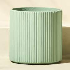 Here's a cool home accessory for this brand new year, the ceramic hanging flower in mint green. Shop Tahiti Large Cement Mint Green Planter Carved Vertical Lines Round This Simple Cylinder To A Multi Dim Modern Planters Modern Planters Outdoor Planters