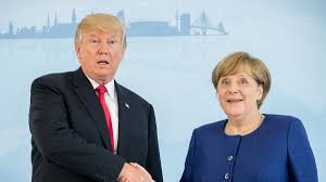 Angela merkel asked president trump to shake hands. The Merkel Trump Handshake Heard Round The World