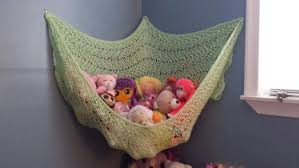 What abut a toy organizer you can make yourself? Diy Stuffed Animal Hammock Made Out Of An Old Blanket And Hooks Stuffed Animal Hammock Diy Stuffed Animal Hammock Diy Stuffed Animal