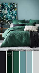 It surrounds a small wooden coffee table on one side of the bed with gold framed, white upholstered royalty chairs. Green Bedroom Color Scheme Dark Blue Grey