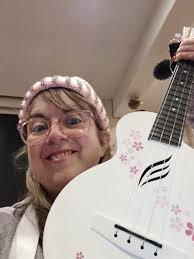 Hi all! I just wanted to introduce myself and share a photo of our local  ukulele group performing