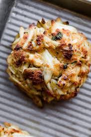 With the addition of bread crumbs, milk, mayonnaise, eggs, pink radishes, yellow onions, and seasonings, the crab meat is infused with flavor and the cost of the food lowered. Maryland Crab Cakes Recipe Little Filler Sally S Baking Addiction