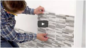 Remove the adhesive backing from just the top couple of inches of the peel and stick tile. Peel And Stick Natural Stone Mosaic Tile For A Quick Upgrade