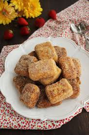 It is made by cooking flour with milk and sugar until it thickens to a firm dough which is then portioned, fried and served with a sugar glaze and cinnamon powder. Como Hacer Leche Frita La Mejor Receta Cocinando Entre Olivos