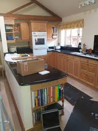 Then thoroughly scrub them with a 50/50 solution of household ammonia and water. Hand Painting A Kitchen Coated In Danish Oil Traditional Painter