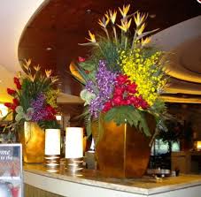 Including fake flowers in a wreath arrangement can add a pop of colour and texture to your display. Artificial Flowers And Fake Flower Arrangements