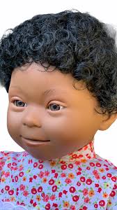 As my biracial baby started to grow from an infant to a toddler, her hair texture, hair type, and even skin color started to change. Doll With Down Syndrome Features Girl Dark Skin Dark Curly Hair Starfish Store Store Education Sensory Specialised