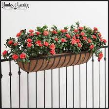 It includes a water reservoir and root saver tray to keep your plants healthy and happy. Make Your Next Deck Rail Planter A Hayrack Trough Coco Lined Iron Garden Containers Look Exquisite Railing Planters Deck Railing Planters Garden Wall Planter