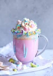 Unicorn Hot Chocolate It S A Creamy Hot White Chocolate Colored Pink Topped With Sprinkles Whipped Crea Unicorn Hot Chocolate Unicorn Desserts Rainbow Food