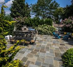 A paver pathway leads out into the backyard to a sitting area that looks back over a reflective pond. Patio Landscaping Ideas New Jersey Outdoor Landscaping Ideas Ideas For Patios Patio Designs Ideas Freehold Nj Jersey Landscaping Monmouth County Nj