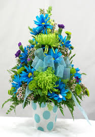 Celebrate the coolest baby boy�s arrival with this charming box arrangement that arrives chock full of pretty flowers. Baby Boy Container Arrangement Orchard Hills Floral Gifts
