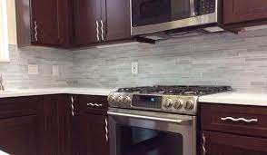 Beautiful Cherry Cabinets In Remodeled Kitchen With White Tile Backsplash And White Quartz Countert Cherry Cabinets Kitchen Kitchen Remodel Diy Kitchen Remodel