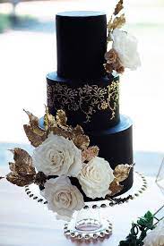 Black And White Wedding Cakes Black Cake With Golden Patterns Decorated With White Roses Wit Black And White Wedding Cake Black Wedding Cakes Gold Wedding Cake