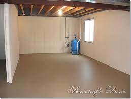 Basement walls of cinder block, brick, or even poured concrete can be transformed pretty quickly and simply with a coat of paint. Parents Of A Dozen Painting An Unfinished Basement Basement Makeover Diy Basement Unfinished Basement