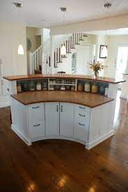 Kitchen island lighting is highly customizable and you will surely find just what you are looking for notice how the countertop curves along the edge which lends character while softening edges and. Rounded Kitchen Island From The Back Curved Kitchen Curved Kitchen Island Kitchen Design