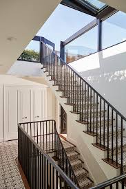 Commercial deck guardrails, such as those found at restaurants, bars, and at multifamily homes such as apartments or condos, are required to be 42 inches high, minimum. Staircase With Chain Link Stair Runner Transitional Deck Patio