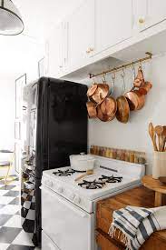 Hanging your pots and pans for easy access frees up cupboards. 8 Genius Storage Ideas For Pots And Pans When You Re Short On Cabinet Space Better Homes Gardens