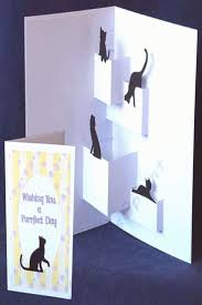 Grab one corner and pull it diagonally across the square to the other corner, lining them up on top of each other. The File Contains The Inside Pop Up With Cat Toppers And Also The Outer Base Card The Oval Cat Fra Cat Cards Handmade Fancy Fold Cards Pop Up Card Templates