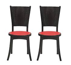 This is a compact set of plastic chairs by nilkamal that come in peach colour and have a sturdy build quality. Supreme Iris Armless Dinning Plastic Chair Red Black Set Of 2 Amazon In Home Kitchen