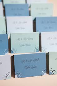 Escort card displays are such a fun place to introduce wedding colors and style to make an impression. Learn How Easy It Is To Hand Punch Your Wedding Stationary