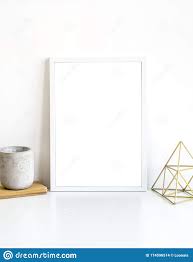White Frame And Home Decoration Details On Tabletop With Wall Artwork Poster Mock Up Stock Photo Image Of Arrangement Backg In 2020 White Frame Poster Mockup Frame